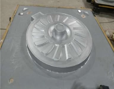Detailed circular die geometry machined into a metal workpiece